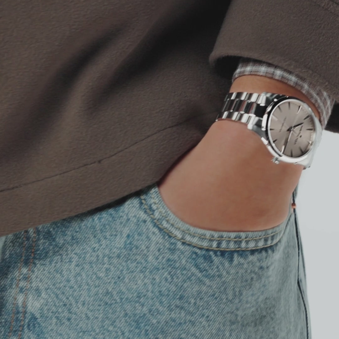 Hamilton Jazzmaster H32461121 40mm quartz watch lifestyle wrist view showing beige dial and polished steel link bracelet