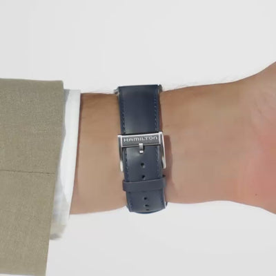 Hamilton Jazzmaster H32705640 automatic watch underside wrist shot showing dark blue leather strap attached to silver pin buckle