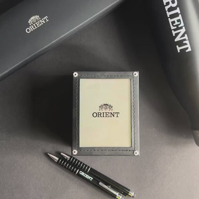 Orient Bambino RA-AC0M11Y30B official watch box set alongside branded promotional accessories