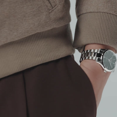 Hamilton Jazzmaster H32461131 steel wristwatch side wrist profile view showing metallic bracelet link detail and slim case design