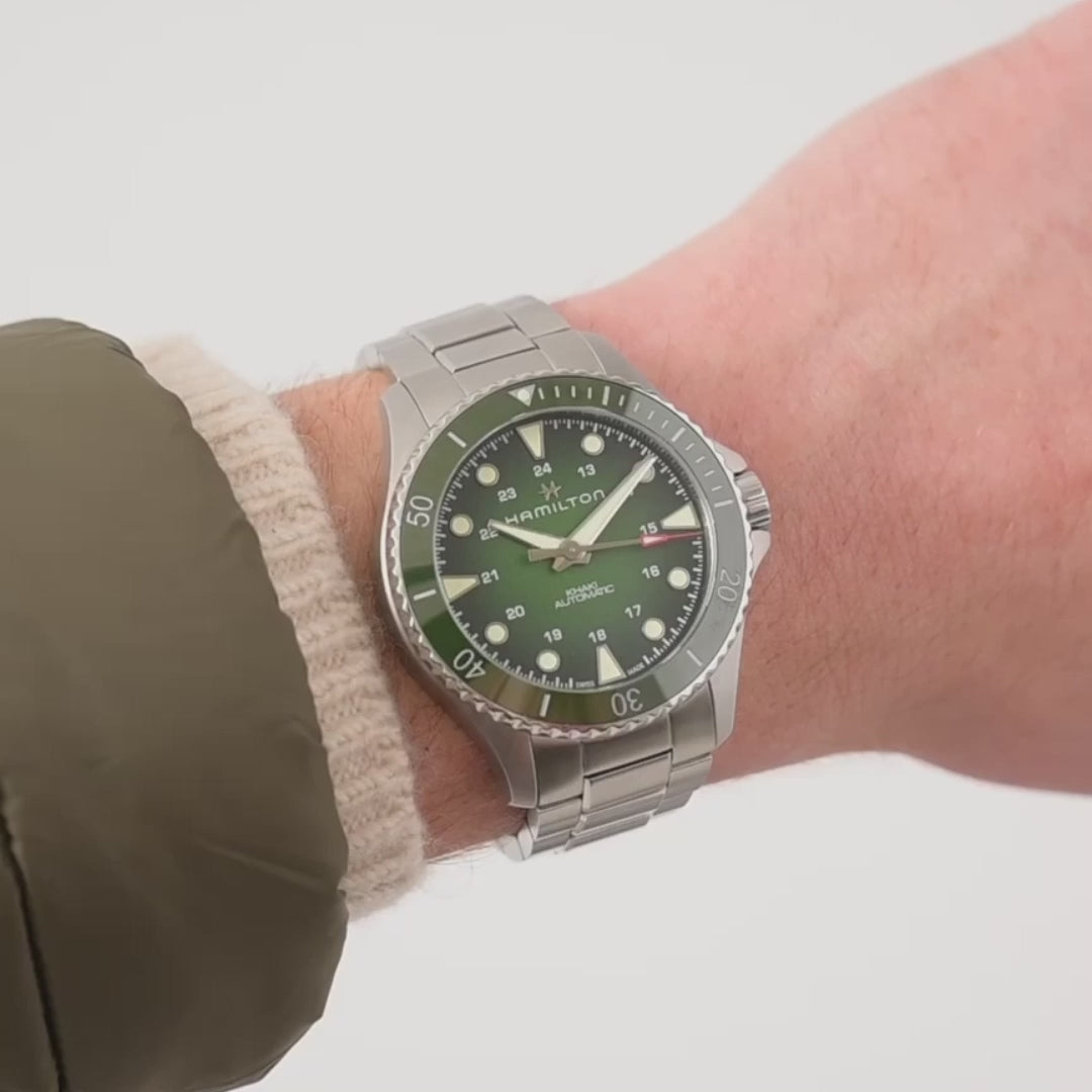 Hamilton Khaki Navy Scuba H82525160 43mm automatic watch direct wrist shot showing green dial and steel link bracelet