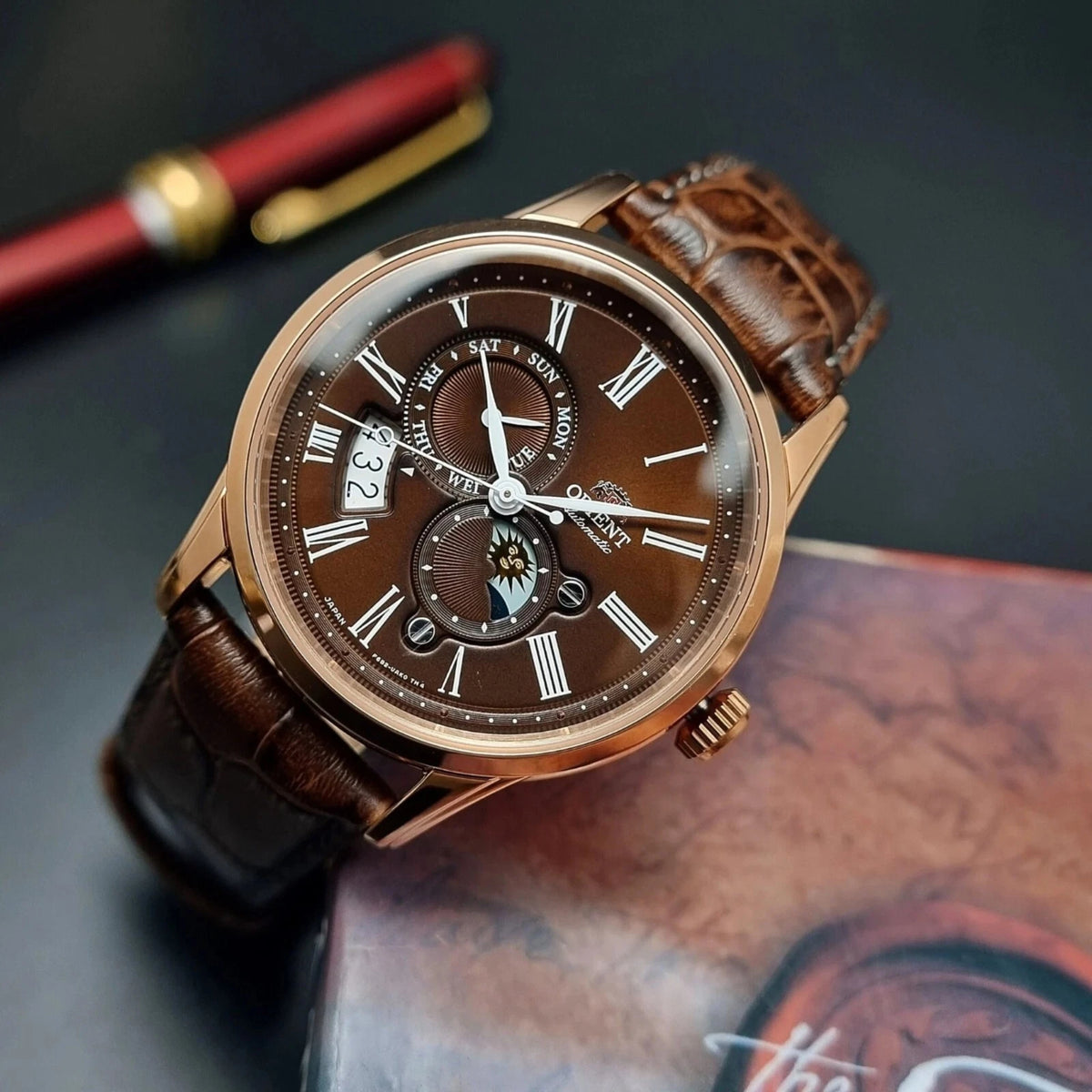 Orient Bambino Sun and Moon automatic watch with moon-and-sun sub-dial and brown leather strap