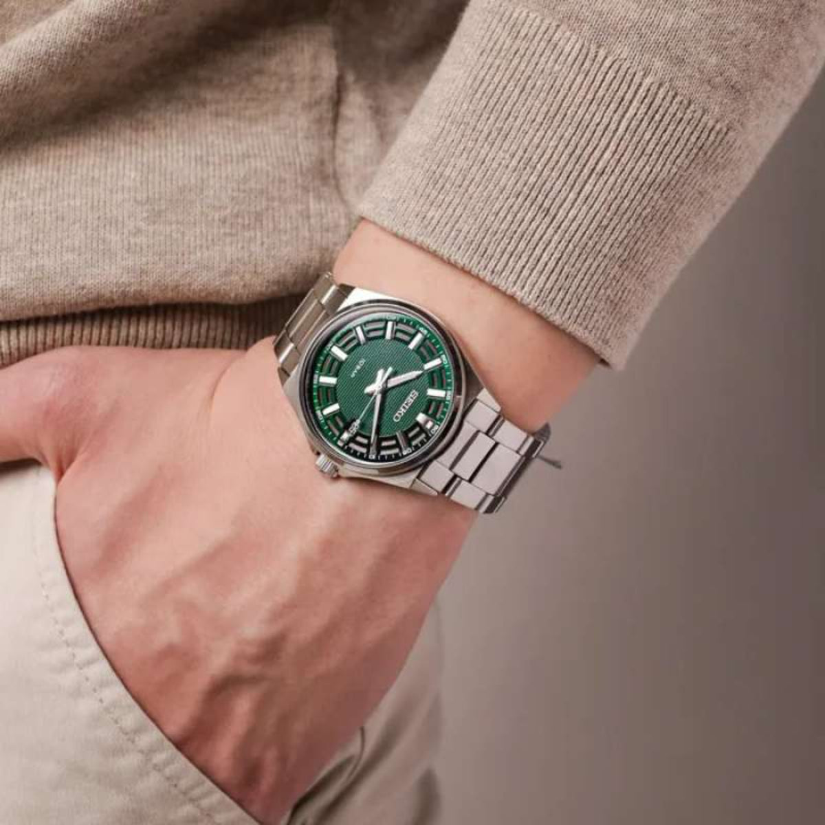 On-wrist lifestyle shot of the Seiko Essentials SUR503P1 quartz timepiece with a men's casual outfit