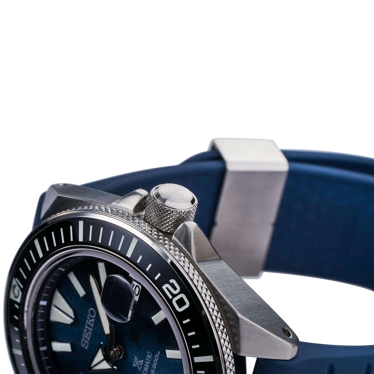 Men's Seiko diver watch with blue silicone strap, crown and rotating bezel detail