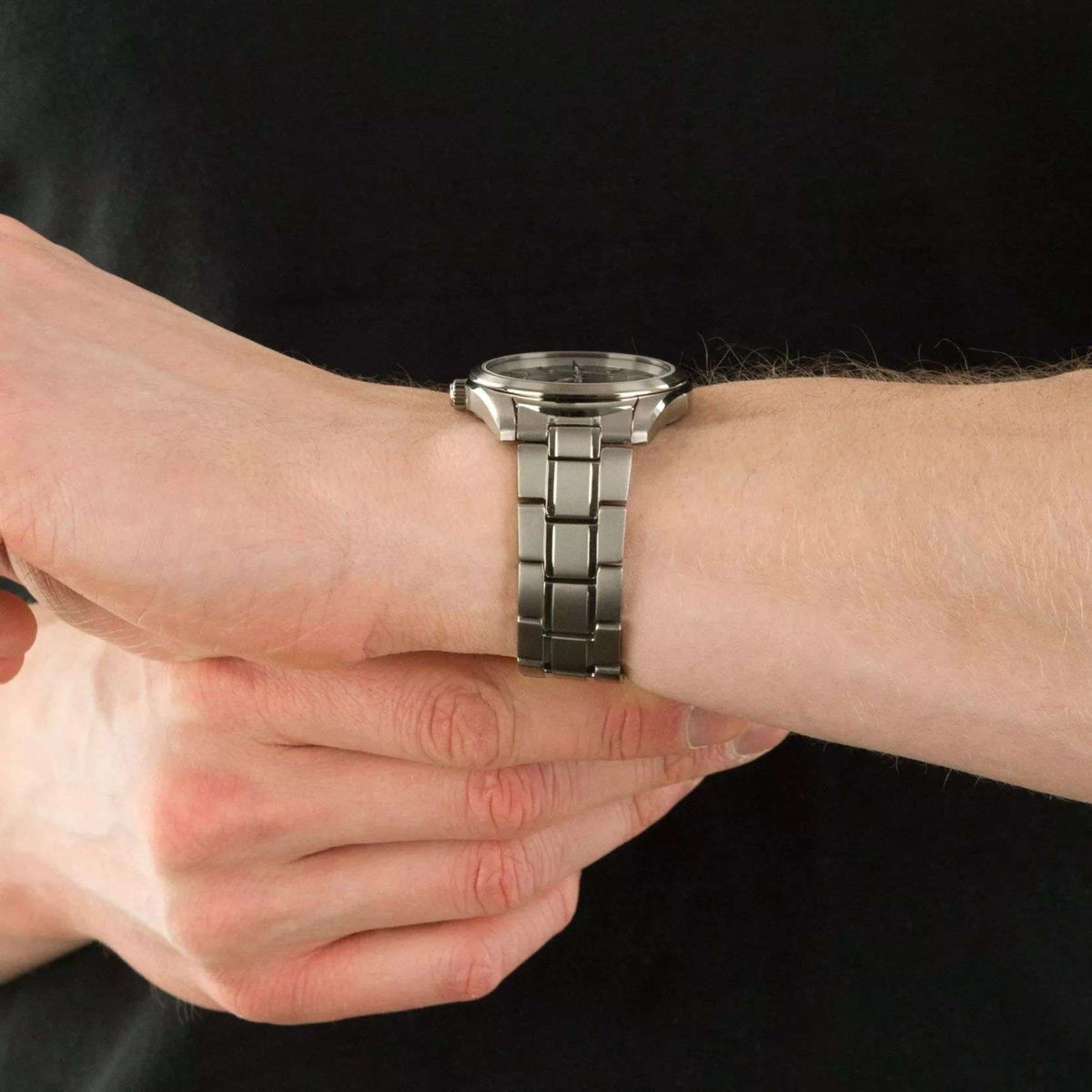 Seiko titanium quartz watch on wrist, silver bracelet and silver dial