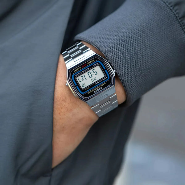 Casio A164WA-1VES steel digital quartz watch on wrist with blue LCD screen