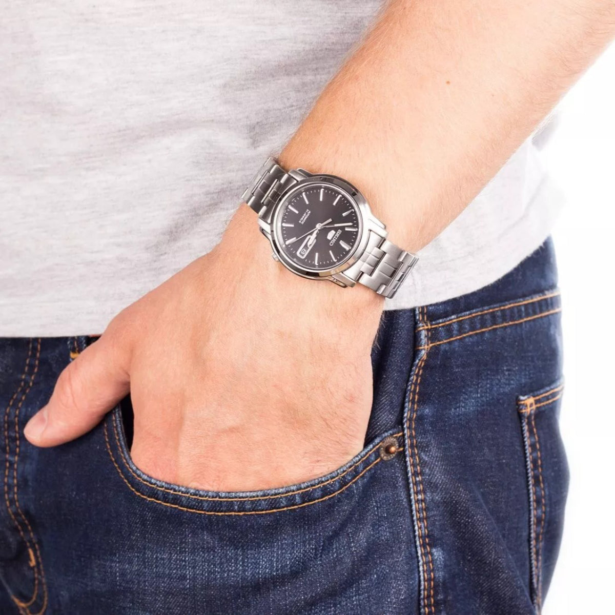 Seiko 5 Classic SNKK71K1 wrist shot showcasing black dial with steel watch bracelet